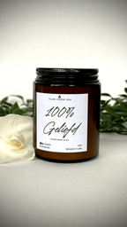 christelijke geurkaars met de tekst 100% geliefd. Deze geurkaars ruikt naar orchidee en ylang